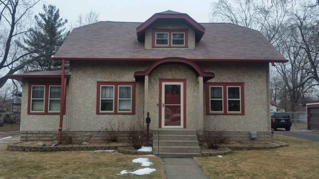 home in need of stucco restoration