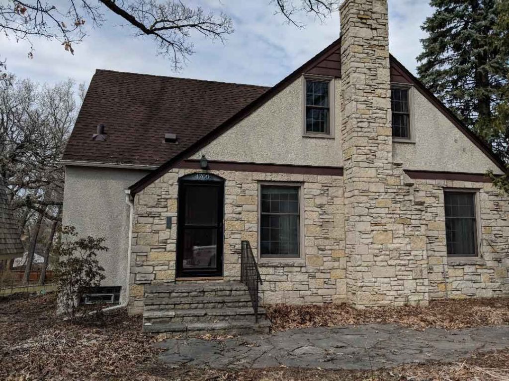 Home with stone veneer needing restoration