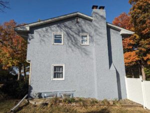 After image to home having both stucco cracks repaired and stucco painted