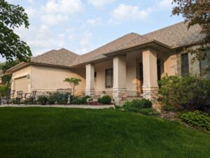 View of a residential home after having stucco repair and painting services