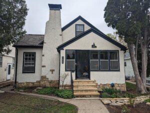 Front yard view of a house that underwent stucco repair and painting services