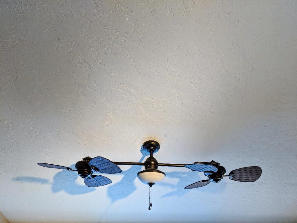 image of ceiling and fan showcasing a plaster restoration project