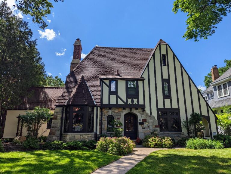 Image of house with wood framing on stucco