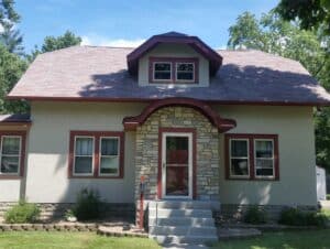 View of the front of a home after having stucco painting services