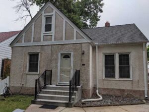 outside view of house with poor stucco quality