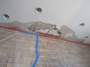 view of ceiling plaster damage before repair