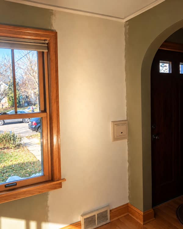 Restored plaster wall in a Twin Cities home featuring smooth finishes, original wood trim, and historic architectural details.